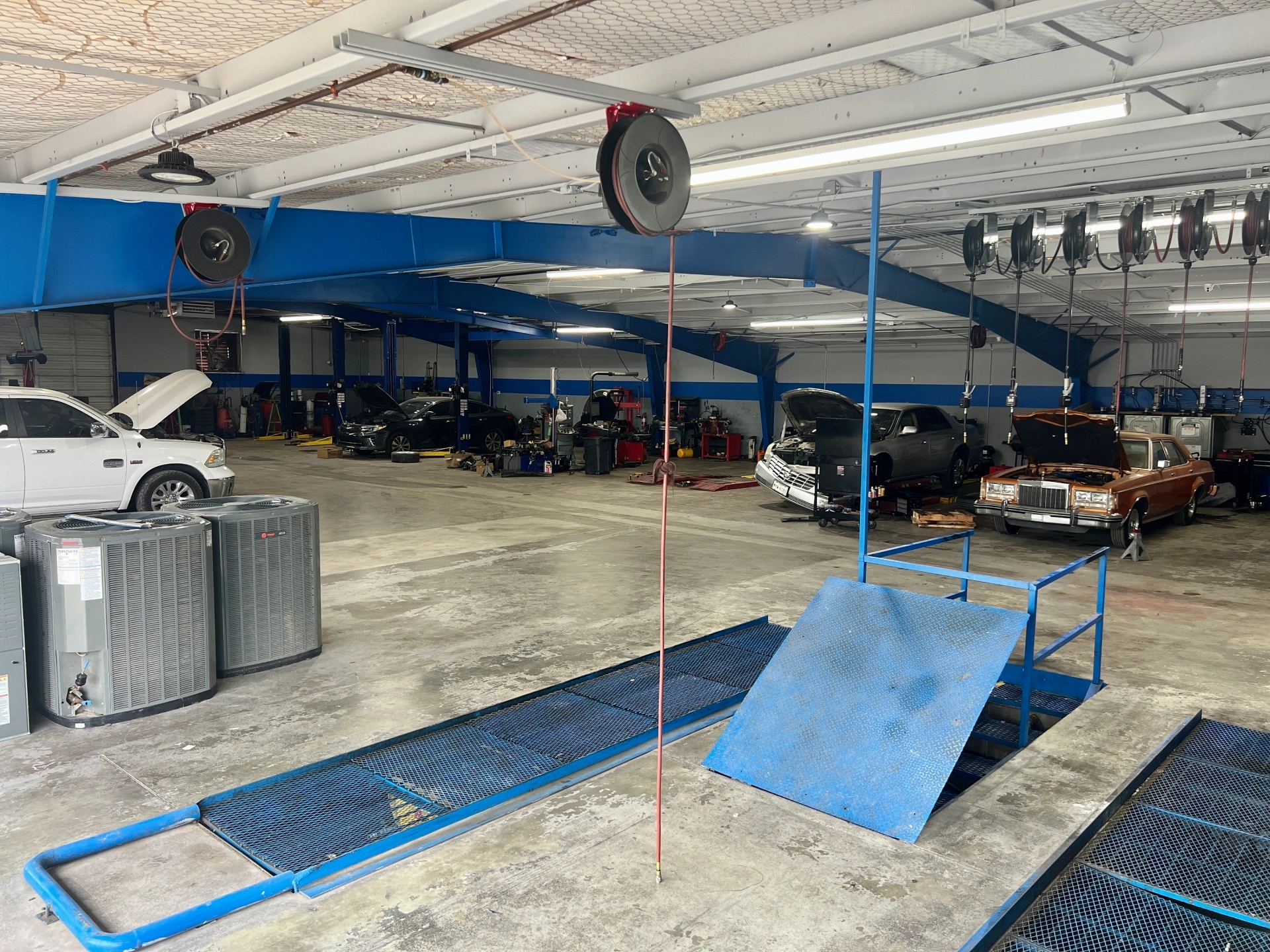 Firestone Buckner automotive repair center with vehicles undergoing service and maintenance.